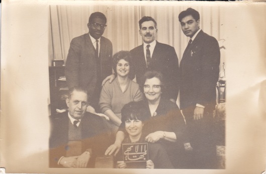 First Local Spiritual Assembly of Barnet (1966) Standing: Roxie Edwards, John Wade, Ranjit Appa. Seated: Mr Nazar, Wendy Ayoub, Rose Wade, Margaret Watkins.  (Missing members: Marie Edwards, Mr Dixon)