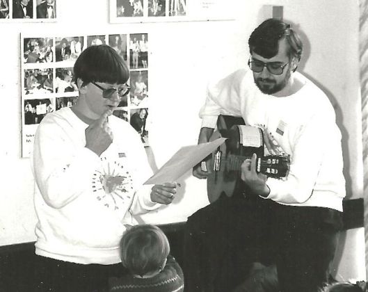 Becky and Tim singing at Thomas Breakwell School