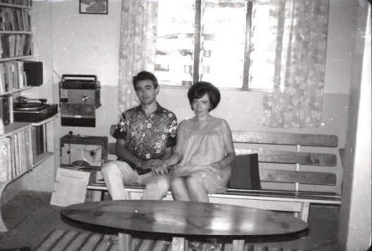 Ivor and Anna, sitting on home-made furniture