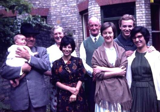 In the back garden of the Cambridge Baha'i Centre, 4 Gonville Place, in 1962. Front row, L to R: Mr Faizi holding Vahid Humphrey; Mahin Humphrey; Marian Mihaeloff; May Faizi (who was living in the Bahá'í Centre at the time). Back row, L to R: unidentified couple; Jeremy Fox