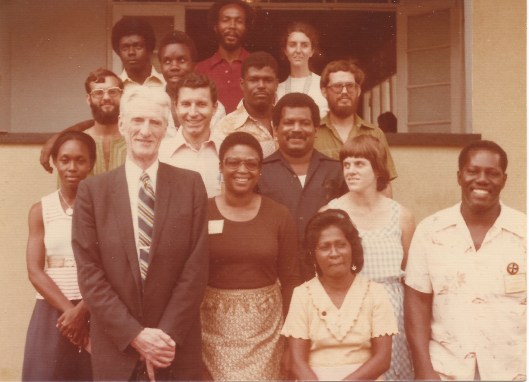 Institution of the Learned, Trinidad 1976/7 - Hand of the Cause Paul Haney (visiting), Counsellor Peter McLaren (pioneer in Venezuela) behind his left shoulder, ABM Laurence Coward behind the Counsellor's left shoulder. Then clockwise, from left to right: Joyce Akins, Gregory Billington (pioneer from USA), Stephen Burris, Joseph Sandy, Sunraev Fraser, Doreen Anderson (pioneer from UK), Denis Anderson (pioneer from UK), Peter Coward, Helena Frank, Joy Billington (pioneer from USA), Samuel Lancaster and Jaitun Abdool