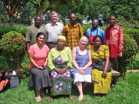 Bangui (2011) with Bahá’ís in the Central African Republic Back row, left to right, Clément Thyrell Feizouré (Continental Counsellor, 2005 – ), Neil Macmillan, Judicaël Mokolé (NSA/National Spiritual Assembly member and now Continental Counsellor, 2015 – ), Anicet Raoul Goudouema (NSA member), Zowé Tiba Nganyadé (Continental Counsellor, 2010-2015) Front row, left to right, Mitra Macmillan (Jane and Neil’s daughter-in-law), Hélène Pathé (NSA member), Jane Macmillan, Marie-Paul Ngaikomos (NSA member)